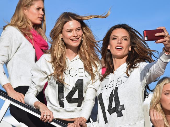 NEW YORK, NY - NOVEMBER 30: (L-R) Victoria's Secret Models Doutzen Kroes, Behati Prinsloo, Alessandra Ambrosio, and Elsa Hosk, depart for London for the 2014 Victoria's Secret Fashion Show at JFK Airport on November 30, 2014 in New York City. (Photo by Mike Coppola/Getty Images for Victoria's Secret)