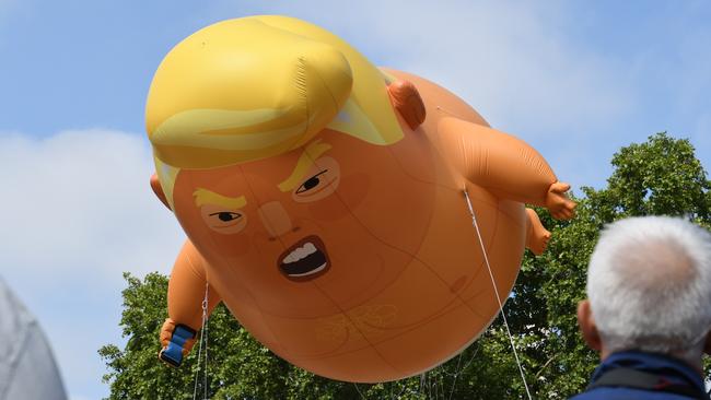 The blimp features a scowling baby Trump clutching a mobile phone. Picture: Matrix