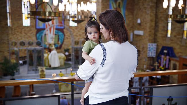 Olena Iwanec held by her mother Nadia Garan during the service. Picture: Sam Ruttyn