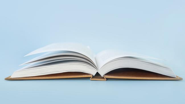 Open book of blank pages on a blue background. copy space