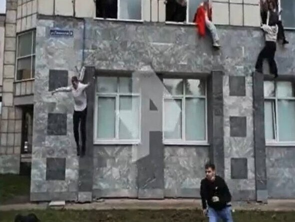 Screengrab of harrowing footage shows people leaping out of a Russian university in the city of Perm to escape a gunman, as mass shootings are on the rise. Picture: Twitter