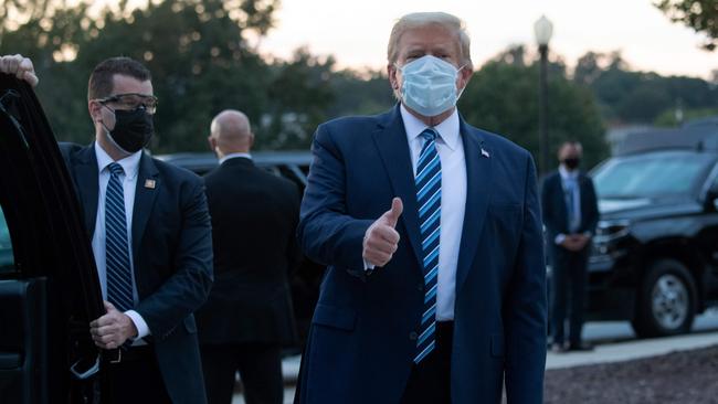 US President Donald Trump gives the thumbs-up as he leaves Walter Reed Medical Center in Bethesda, Maryland. Picture: AFP