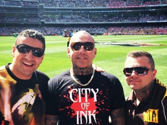 Kazem Hamad (left) at the footy with Toby Mitchell and senior Mongol bikie Tyrone Bell prior to being deported. Picture: Instagram