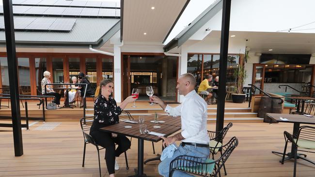 One of the Gold Coast's biggest pubs is opened in just weeks ago to serve just 10 people when it has a seating capacity of 800. Jemma Ellis and Adam Syla get ready to eat at Robina Pavilion. Picture Glenn Hampson