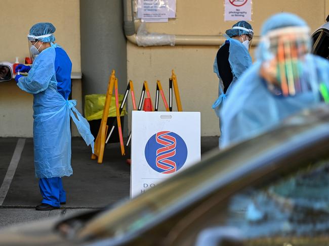 SYDNEY, AUSTRALIA - NewsWire Photos, AUGUST, 17, 2021: Health workers dressed in Personal Protection Equipment (PPE) conduct COVID-19 testing at the Mosman Douglas-Hanly Moir Pathology Drive-Through clinic in Sydney. Picture: NCA NewsWire/Bianca De Marchi