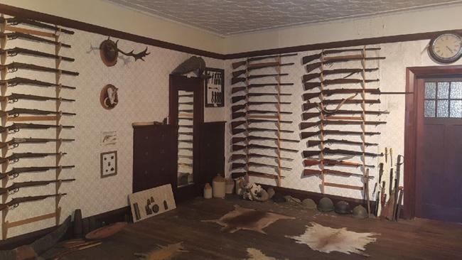 Police seized 73 long arms from the rural hunting room.