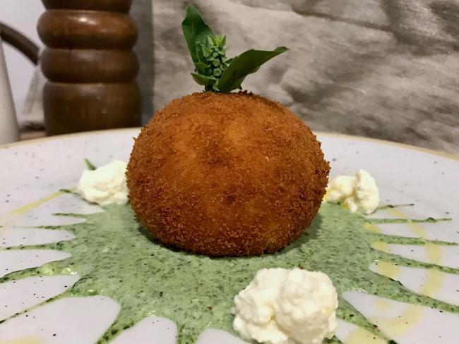 The breakfast arancini: Baked potto mash roll and filled with ricotta, spinach, parmesan and a soft poached egg. Picture: Jenifer Jagielski