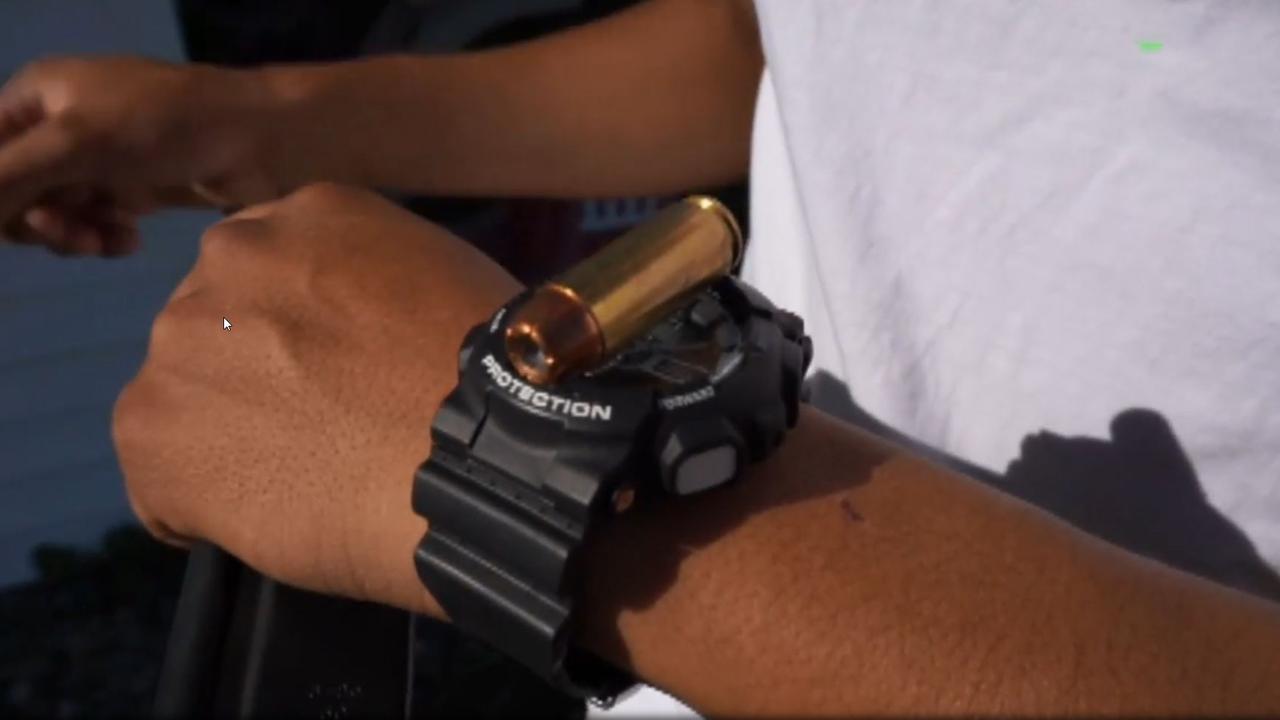 Mr Ruiz compares the size of the bullet to his watch for scale.