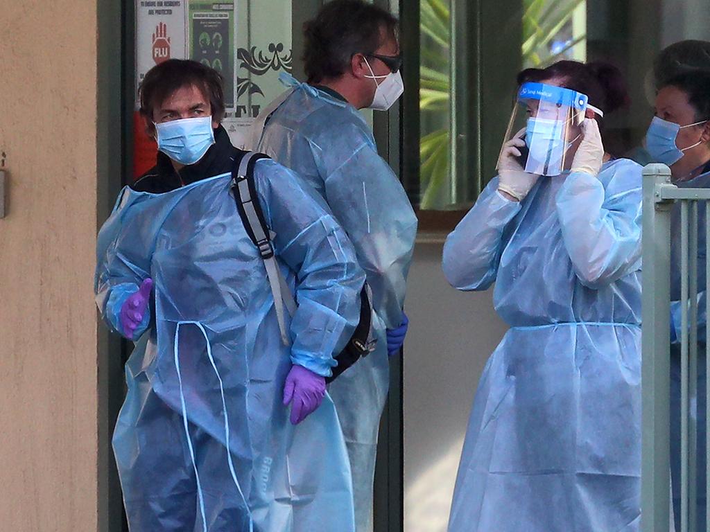 Staff assemble out the front of St Basil's nursing home in Fawkner. Picture: Aaron Francis/The Australian