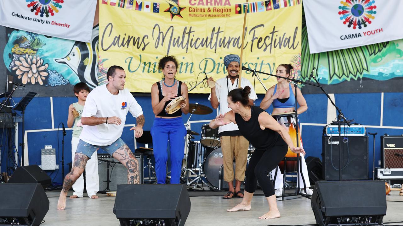 The Moon Nation band play as Cairns Brazilian Club members perform capoeira on stage at the 19th annual CARMA multicultural festival, held at Fogarty Park. Picture: Brendan Radke