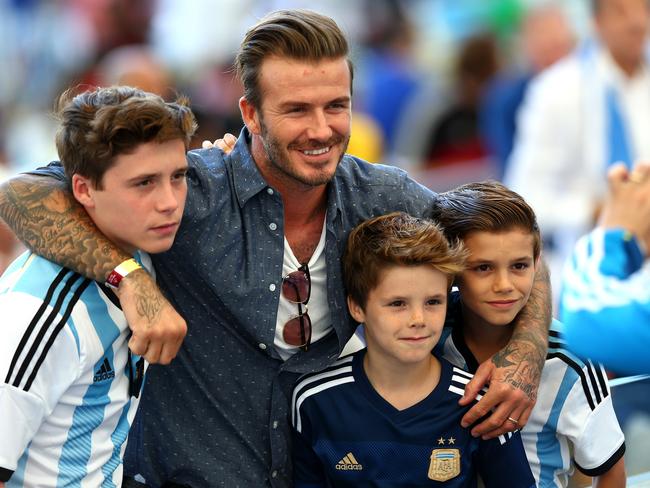RIO DE JANEIRO, BRAZIL - JULY 13: Former England international David Beckham and sons Brooklyn Beckham (L), Cruz Beckham (2nd R) and Romeo Beckham (R) prior to the 2014 FIFA World Cup Brazil Final match between Germany and Argentina at Maracana on July 13, 2014 in Rio de Janeiro, Brazil. (Photo by Michael Steele/Getty Images)