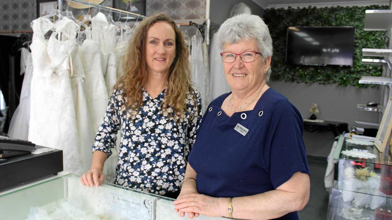 Owner of Rendezvous Designs and founder of Burnett Bridal and Formal Events Helen Chaseling and wedding celebrant Rhonda Callow inside the shared showroom. Picture: Laura Blackmore