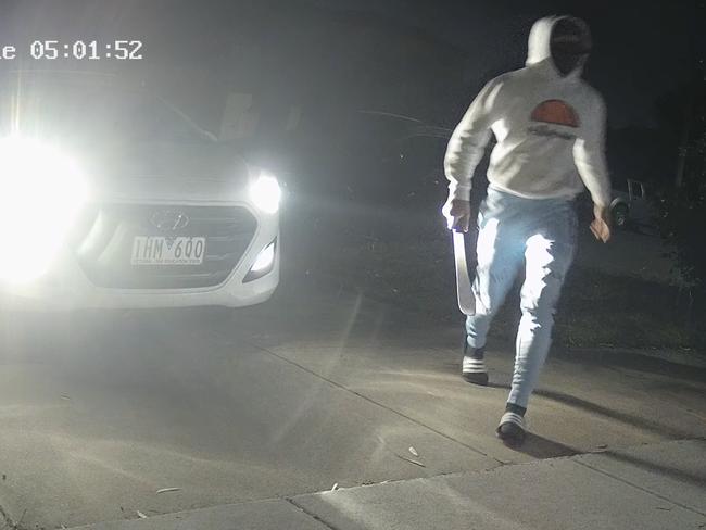 A man wielding a machete is captured on CCTV at a home invasion in Black Rock. Picture: Supplied