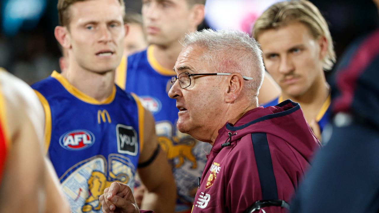 MELBOURNE, AUSTRALIA - MAY 26: Chris Fagan, Senior Coach of the Lions addresses his players at three quarter time during the 2024 AFL Round 11 match between the Hawthorn Hawks and the Brisbane Lions at Marvel Stadium on May 26, 2024 in Melbourne, Australia. (Photo by Dylan Burns/AFL Photos via Getty Images)