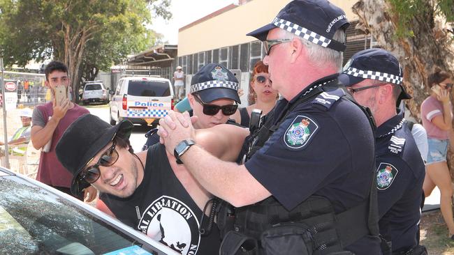 Black Swan Lake protest at Bundall goes to another level, with protesters chaining themselvesto the fence and then getting themselves arrested after running onto the worksite and stopping the trucks.  Protestor known only as "Kaiser" makes life hard for police when he ran onto the worksite and staged a sitdown protest. He was handcuffed and taken away by police..Picture Glenn Hampson