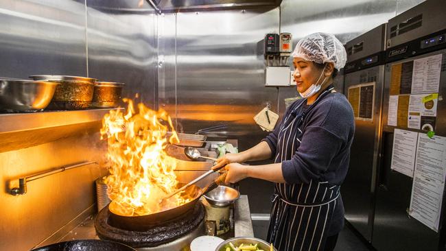 Apprentice chef at Dava Restaurant in Frankston, Aom Kay, cooking Thai food.. Aaron Francis/The Australian