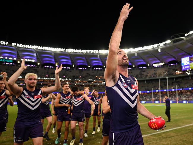 Alex Pearce leads the Dockers off after their victory over Adelaide. Picture: Daniel Carson/AFL Photos via Getty Images