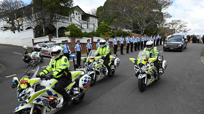 A police guard of honour for former police commissioner Jim O'Sullivan at his funeral on Thursday. Picture: Lyndon Mechielsen/Courier Mail