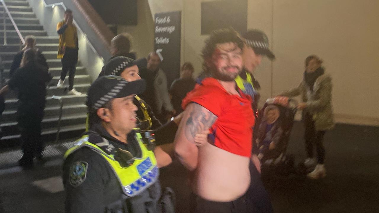 A fan is arrested at The Drive fan venue during the Matildas vs. England game. Picture: Todd Lewis