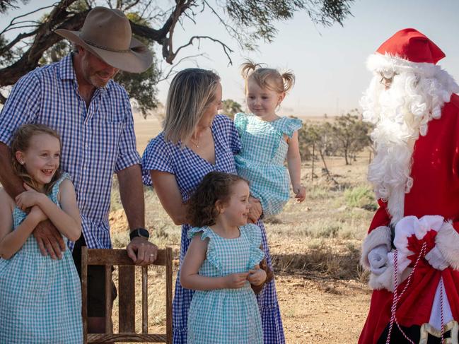 ADELAIDE, SOUTH AUSTRALIA - Advertiser Photos DECEMBER 22, 2024: Santa visits Grain Farmer Andrew Walker and his family wife and children Elsie 7yrs, Callie 5yrs and Lucy 3yrs at their Booleroo Centre property, SA. Picture: Emma Brasier