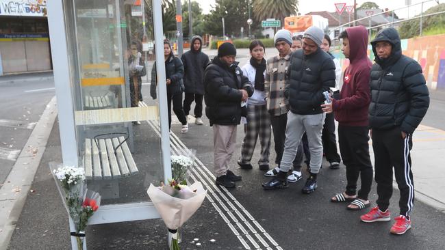 Family and friends lay flowers at the scene in Sunshine where Pasawm died. Picture: David Crosling