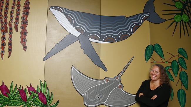 Indigenous artist Natalie Bateman with the mural she has painted in the waiting room of the emergency department at Prince of Wales Hospital. Picture: John Appleyard