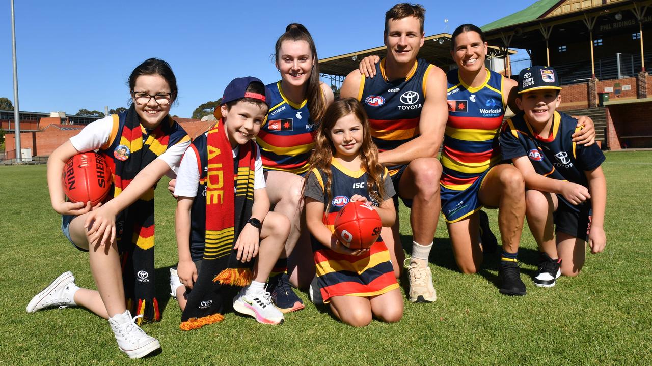 Crows fans Matilda, Benji, Eva and Jordan with Crows players Sarah Allan, Jordan Dawson and Chelsea Randall. Picture: Keryn Stevens