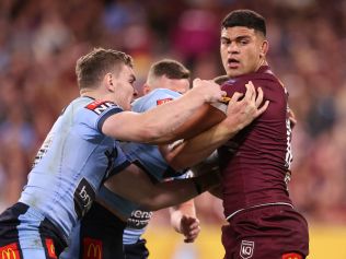 TOWNSVILLE, AUSTRALIA - JUNE 09:  David Fifita of the Maroons is tackled during game one of the 2021 State of Origin series between the New South Wales Blues and the Queensland Maroons at Queensland Country Bank Stadium on June 09, 2021 in Townsville, Australia. (Photo by Mark Kolbe/Getty Images)