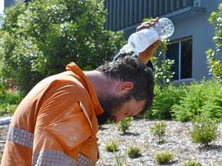 Gympie labourer Dan Stevenson attempts to cool down with a little water. Picture: Donna Jones