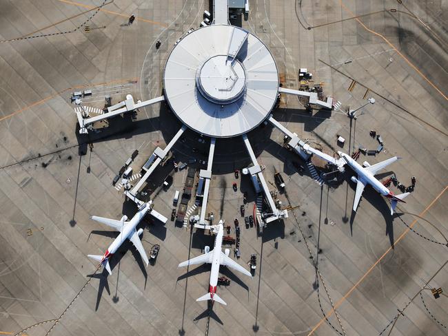 DO NOT USE BEFORE DEC 28TH, CONTACT COURIER MAIL PIC DESK Aerial images over Brisbane in summer. Qantas planes at Brisbane Domestic Airport.