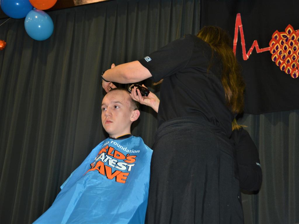 At the St Joseph's College 2023 World's Greatest Shave event is student Ljay Radke having his cut by hairdresser Jillian Grundy from the Hair Room on Russell. Picture: Rhylea Millar