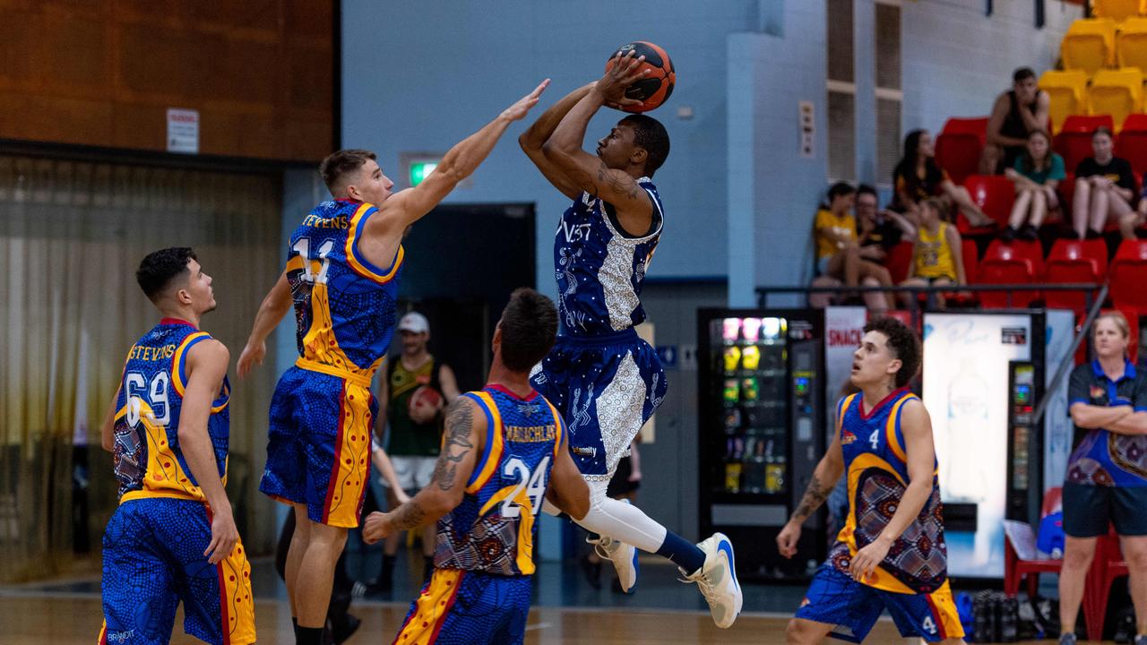 Fred Williams from Ansett on a contested jumpshot in the paint. Darwin Basketball Men's Championship Round 20: Ansett v Tracy Village Jets. Picture: Che Chorley