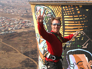 Attraction ... a thrillseeker rides the power swing at Orlando Power Station in Soweto, South Africa / AAP