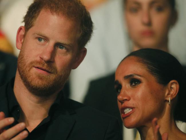 Harry, Duke of Sussex and patron of the Invictus Games (L), and his wife Meghan, Duchess of Sussex, attend the closing ceremony of the 2023 Invictus Games in Duesseldorf, western Germany on September 16, 2023. The Invictus Games, an international sports competition for wounded soldiers founded by British royal Prince Harry in 2014, was taking place from September 9 to 16, 2023 in Duesseldorf. (Photo by LEON KUEGELER / AFP)