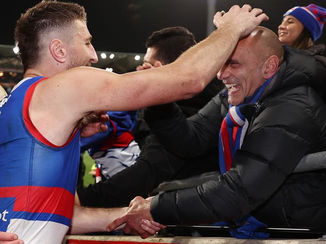 Toby Liberatore of a win with Bulldogs captain Marcus Bontempelli. Picture: Michael Klein.