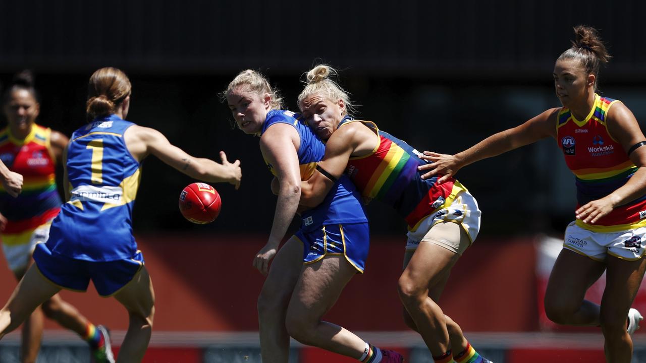 Erin Phillips wrenches the ball free in a tackle.