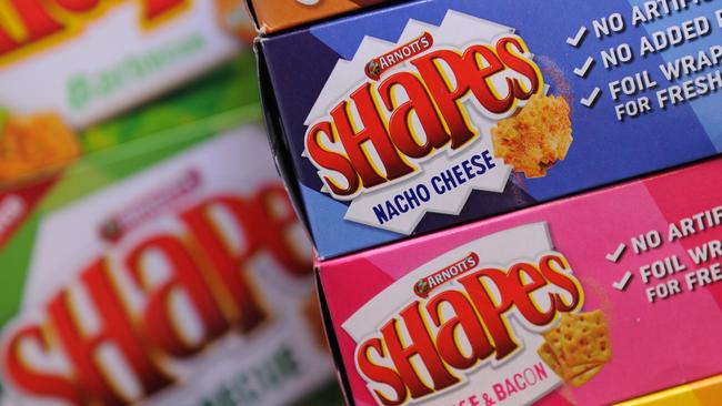 Packets of Arnott's biscuits pictured in Sydney, Friday, April 15, 2016. Arnott's has changed the flavour of its classic Shapes and released two new varieties, Roast Chicken and Hot Dog. (AAP Image/Joel Carrett) NO ARCHIVING