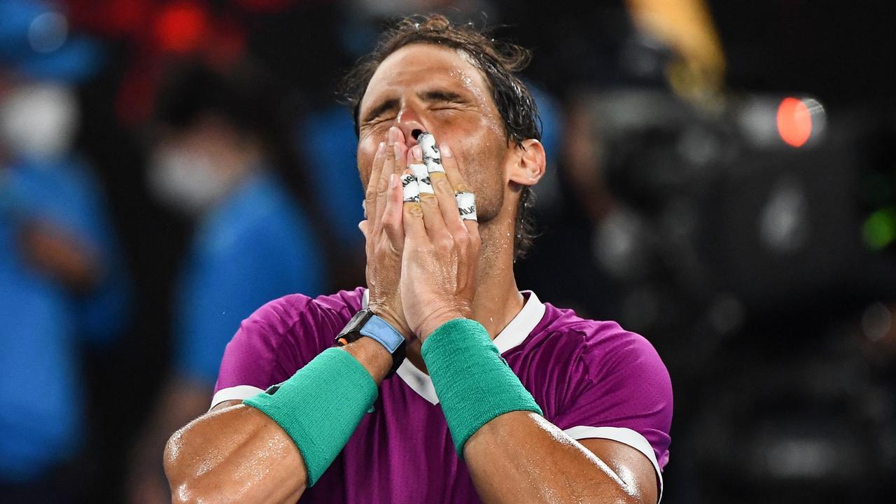 Spain's Rafael Nadal celebrates after victory against Italy's Matteo Berrettini during their men's singles semi-final match on day twelve of the Australian Open tennis tournament in Melbourne on January 28, 2022. (Photo by William WEST / AFP.