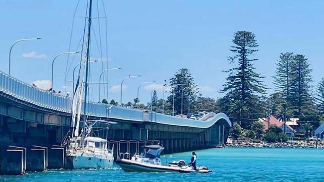 The yacht crashes into the bridge at Forster on Sunday (looking across to Tuncurry).