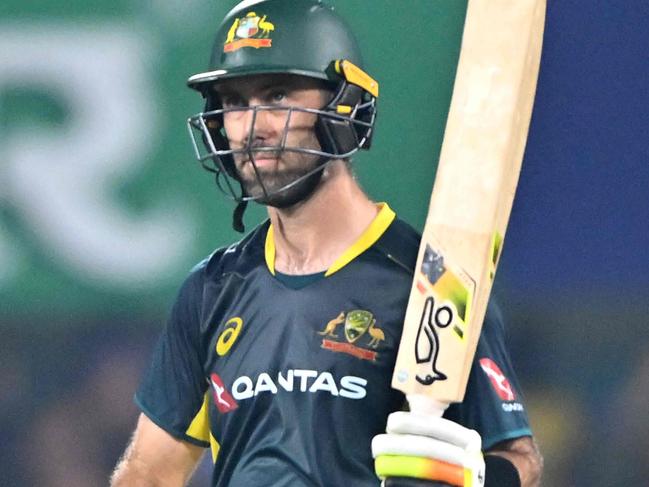 Australia's Glenn Maxwell celebrates after scoring a century (100 runs) during the third Twenty20 international cricket match between India and Australia at the Assam Cricket Association Stadium in Guwahati on November 28, 2023. (Photo by Biju BORO / AFP) / -- IMAGE RESTRICTED TO EDITORIAL USE - STRICTLY NO COMMERCIAL USE --