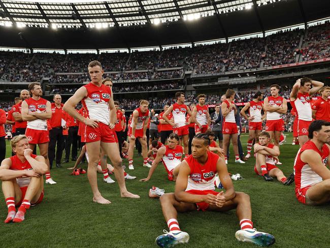 Dejected Swans players come to terms with the defeat.