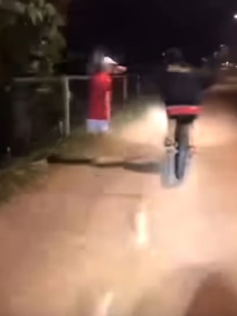 A video posted to a southern Gold Coast Facebook community page has shown the moment two boys conspire to throw liquid on to a walker. Photo: Facebook