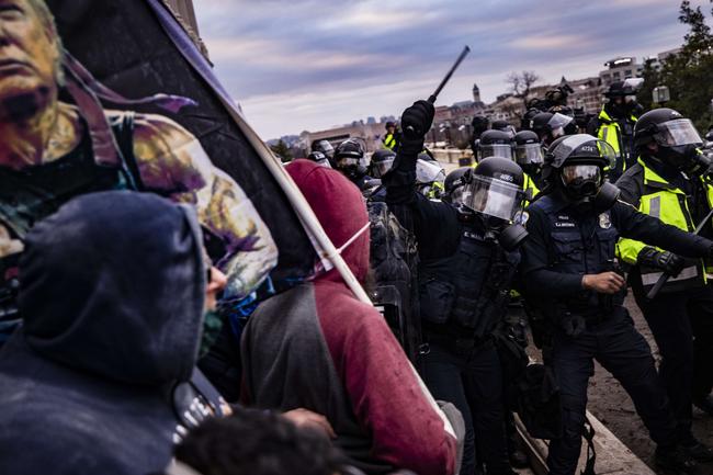 WASHINGTON, DC: Police officers attempt to push back a pro-Trump mob trying to storm the U.S. Capitol following a rally with President Donald Trump. Picture: Samuel Corum/Getty Images/AFP