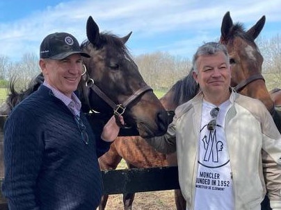 American racehorse owner John Stewart (right) and Inglis managing director Mark Webster with Stewart's $US6m purchase – the Group 1-winning sprinter Goodnight Olive – at Resolute Farm in Kentucky, US. Picture: Supplied