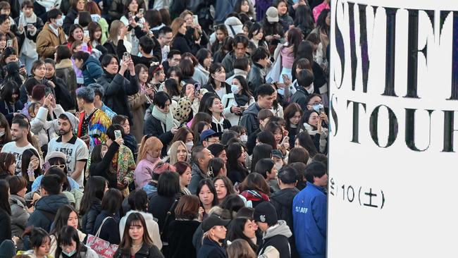 Fans of US singer Taylor Swift, also known as Swifties, queue to enter the Tokyo Dome shortly before the start of the first leg of her Asia-Pacific Eras Tour in Tokyo on February 7. Picture: AFP.