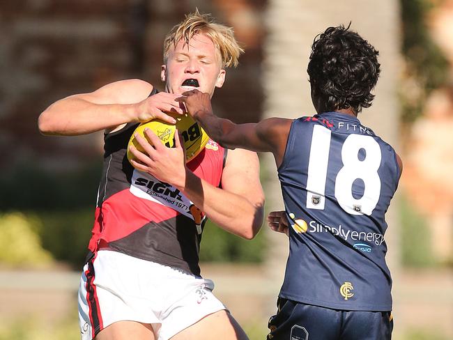 Sport. WAFL. Colts action at Claremont Oval. Demon Jack Avery marks in front of Tiger Patrick Kitchener. Picture Jackson Flindell The West Australian