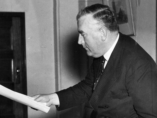 One senior Liberal insists the Coalition remains rooted in the foundations established by Robert Menzies in 1941, pictured packing official papers at his office in Melbourne before his departure for London.