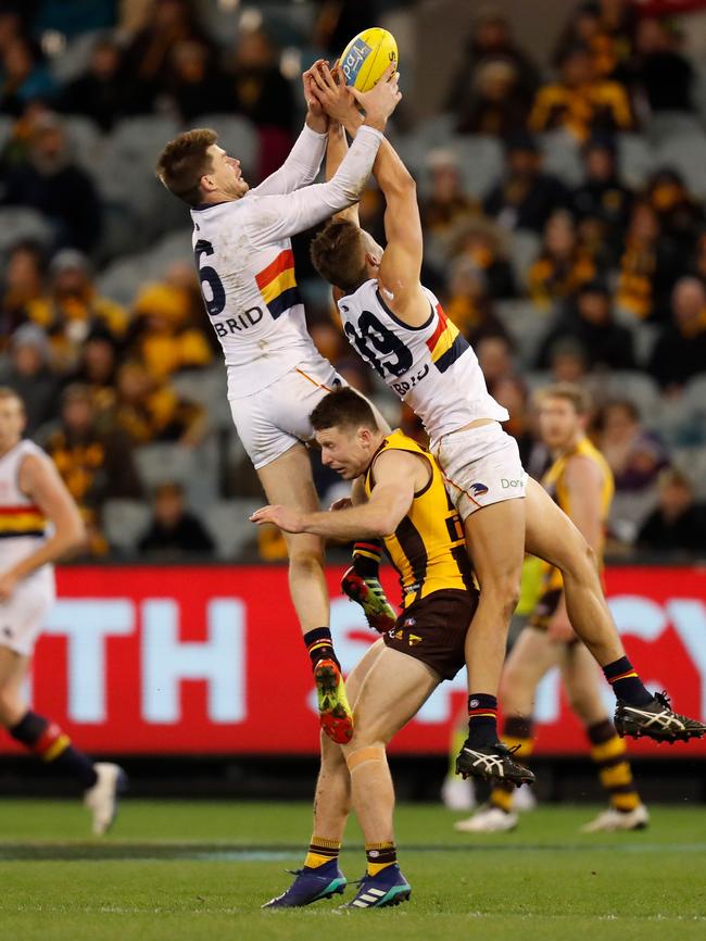 New Crow Bryce Gibbs  marks over Hawk Liam Shiels and Crow Tom Doedee. Picture: Michael Willson/AFL Media/Getty Images