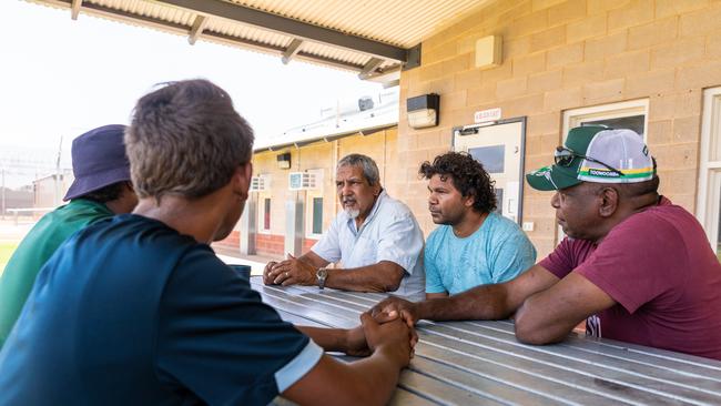 Michael Liddle, Martin Hagan, and Wayne Scrutton from the Aboriginal Elders and Mentors Program talk with young people at the Alice Springs Youth Detention Centre. Photo: Emma Murray