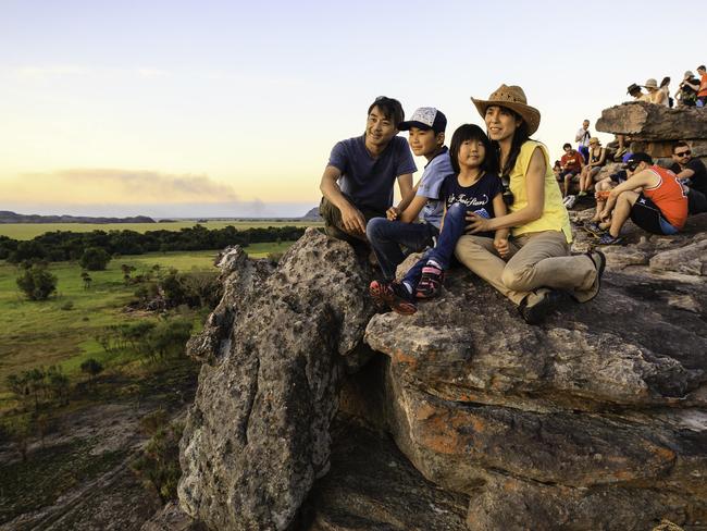 Tsuyoshi Saikachi with his wife Hitomi Saikachi and their children Yuki, 12, and Minori, 7, at Ubirr in Kakadu National Park.